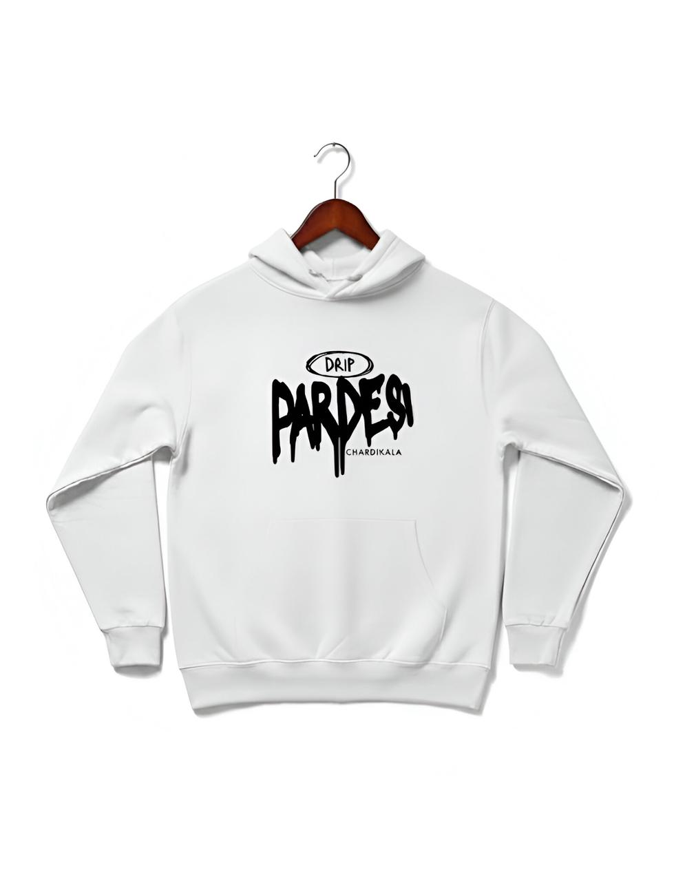 Crisp white hoodie showcasing a bold, black graphic that immediately grabs attention with its striking typography.
The central design features the word "PARDESI" in a stylized, dripping font, evoking a raw and edgy street-art aesthetic. Above "PARDESI," the word "DRIP" is subtly enclosed in an oval, reinforcing a contemporary fashion vibe and urban coolness. Below the main text, "CHARDIKALA" is inscribed, adding a touch of cultural depth and positive spirit, known to resonate within the Sikh community.
