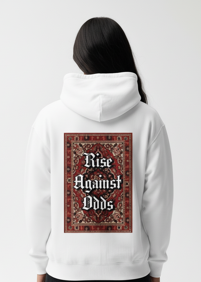 White hoodie with 'Rise Against Odds' design on the back, worn by a person against a white background