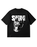 Black oversized French Terry T-shirt features a large, bold graphic of a historical figure, Maharani Jindan Kaur, with the word "SHERNI" in large white block typography in the background. The design is loud, graphic, and culturally inspired.