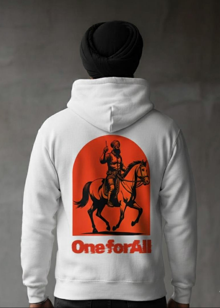 Person wearing a hoodie with a graphic design featuring a horse and a Sikh Rider on a dark background
